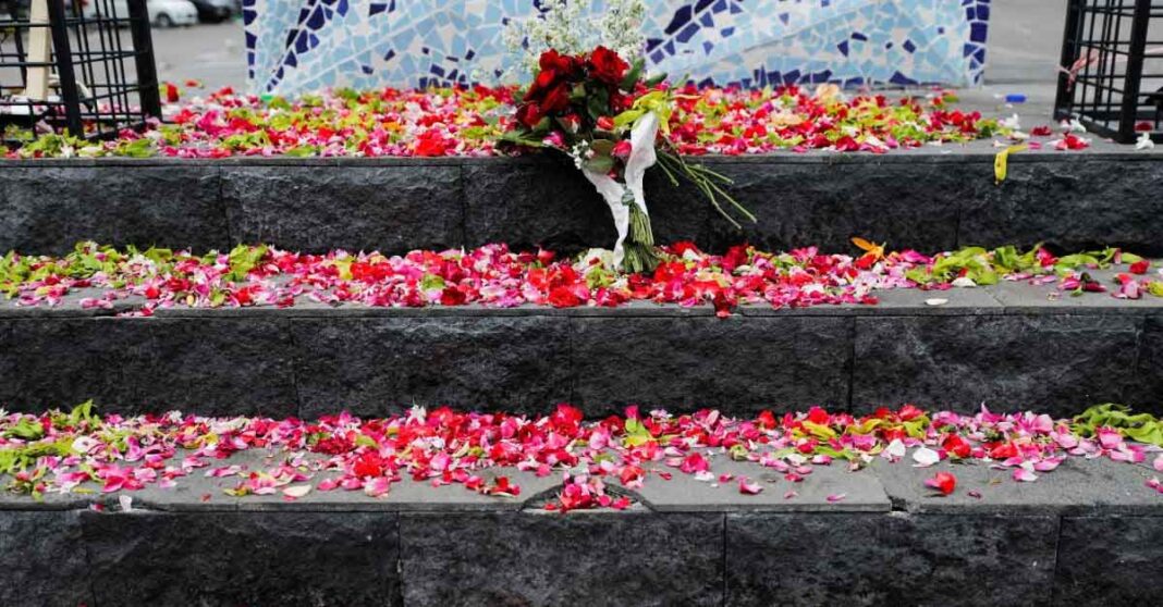 Petals are placed on Aremania monument outside the Kanjuruhan stadium to pay condolence to the victims of the stadium stampede.