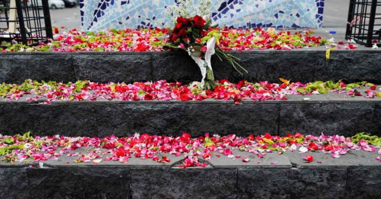 Petals are placed on Aremania monument outside the Kanjuruhan stadium to pay condolence to the victims of the stadium stampede.