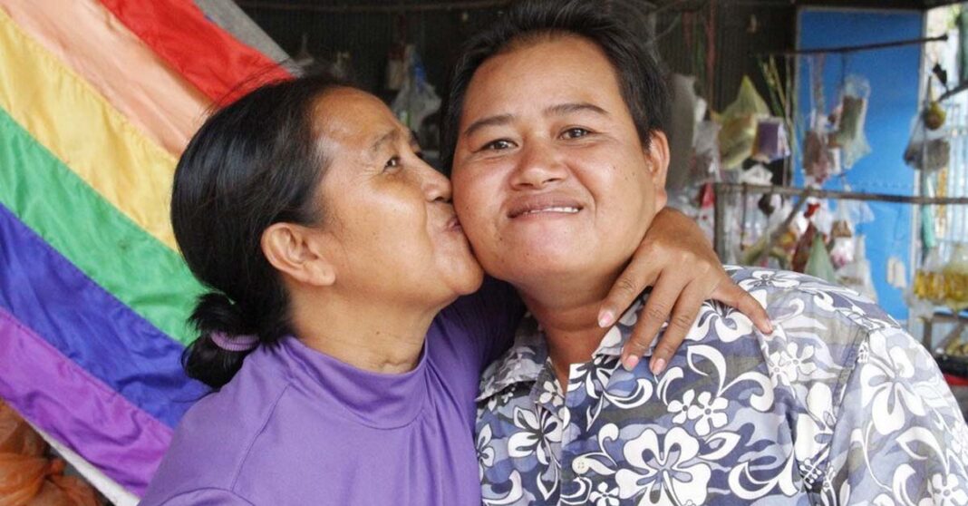 Changing families give rise to needed policy changes. Sao Mimol kisses her partner in Cambodia during an LGBT Pride event. (file)