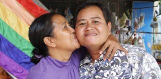 Changing families give rise to needed policy changes. Sao Mimol kisses her partner in Cambodia during an LGBT Pride event. (file)