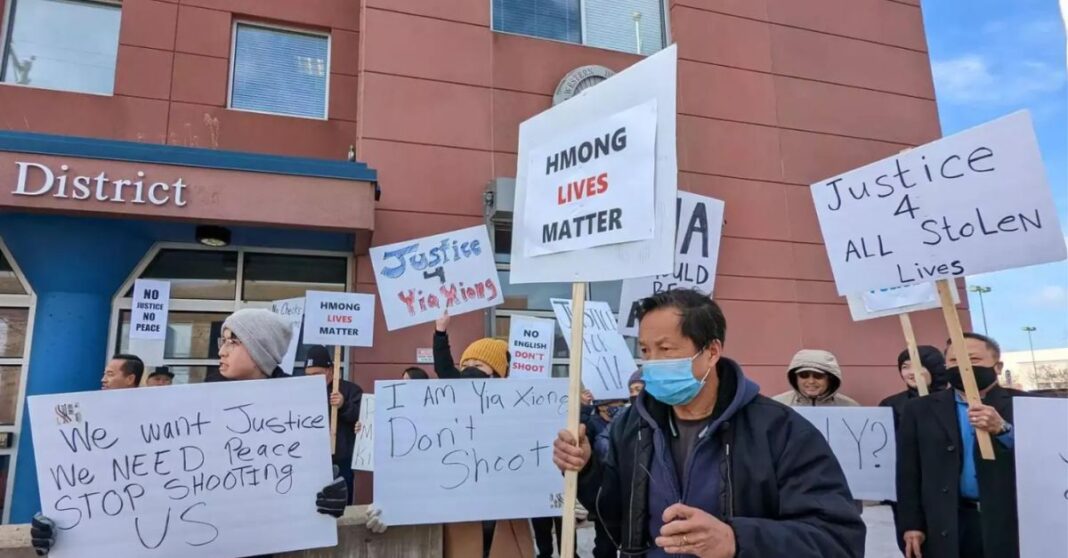 Demonstrators chant, 