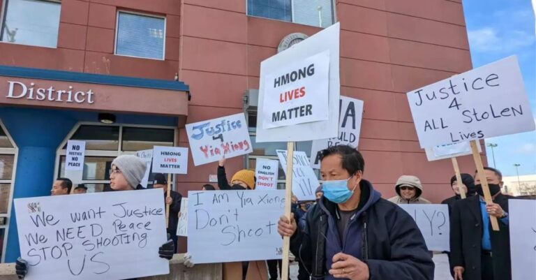 Demonstrators chant, "I'm deaf, don't shoot," as they march in front of the St. Paul Police Department's Western District office on Sunday, February 19, 2023. Credit: Simone Cazares | MPR News