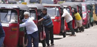 Auto rickshaw drivers line up to buy gas near a fuel station in Colombo, Sri Lanka, Wednesday, April 13, 2022. AP Photo/Eranga Jayawardena, File)