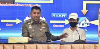 Deputy National Police Chief Surachet Hakpal, left, talks to reporters with Tubtim "Sue" Howson, 57, during press conference at police headquarter in Bangkok, Thailand, Wednesday, Feb. 15, 2023.