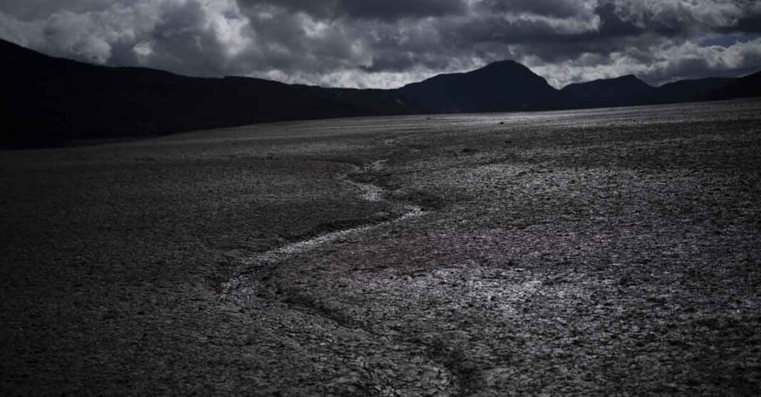 A usually submerged section of the lake Serre-Poncon is dry in southern France, March 14, 2023. A major new United Nations report being released Monday, March 20, 2023, is expected to provide a sobering reminder that time is running out if humanity wants to avoid passing a dangerous global warming threshold. (AP Photo/Daniel Cole, File)