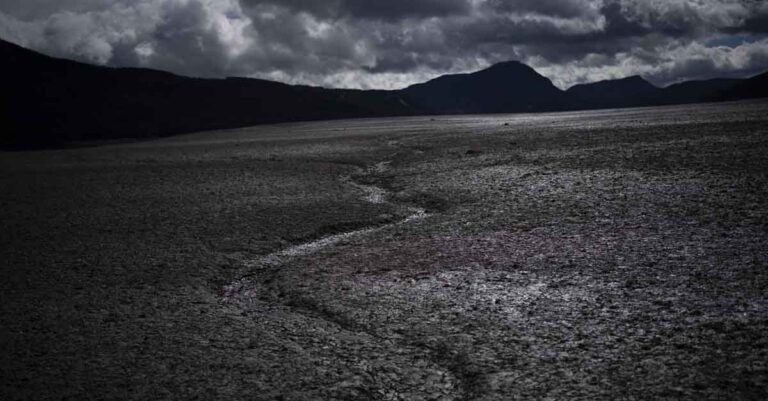 A usually submerged section of the lake Serre-Poncon is dry in southern France, March 14, 2023. A major new United Nations report being released Monday, March 20, 2023, is expected to provide a sobering reminder that time is running out if humanity wants to avoid passing a dangerous global warming threshold. (AP Photo/Daniel Cole, File)