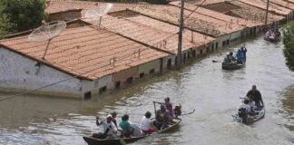 People travel by boat in a flooded street in Trizidela do Vale, state of Maranhao, Brazil, May 9, 2009. The intensity of extreme drought and rainfall has “sharply” increased over the past 20 years, according to a study published Monday, March 13, 2023, in the journal Nature Water. (AP Photo/ Andre Penner, File)