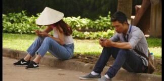 Vietnamese people on phones using social media.