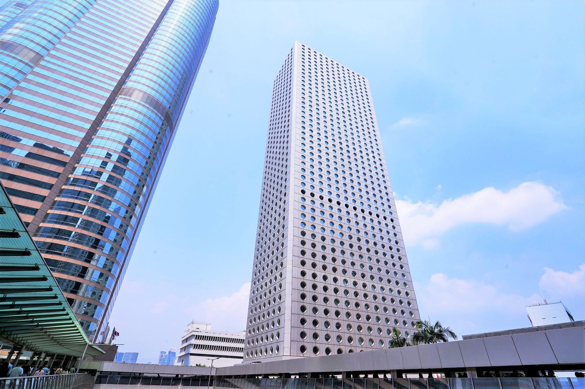Jardine House is a prominent part of the renowned Hong Kong skyline with its distinctive architectural features.