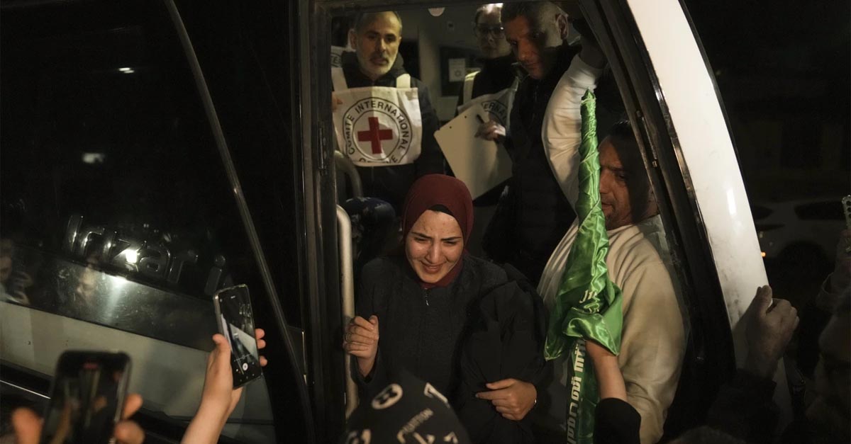 ﻿ A woman smiles as she is welcomed after being released from prison by Israel, in the West Bank town of Ramallah, early Thursday, Nov. 30, 2023 International mediators on Wednesday worked to extend the truce in Gaza, encouraging Hamas militants to keep freeing hostages in exchange for the release of Palestinian prisoners and further relief from Israel's air and ground offensive. (AP Photo/Nasser Nasser)