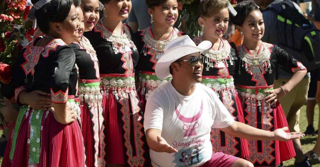 Founder and organizer Tou Ger Xiong, front, poses with a group of Hmong dancers during Hmong Minnesota Day at the Minnesota State Fair, Sept. 6, 2021, in Falcon Heights, Minn. On Wednesday, Dec. 13, 2023, Colombian authorities were investigating the alleged kidnapping and murder of the Hmong American comedian and activist Xiong, who was found dead Monday, Dec. 11, in a wooded area of the northern city Medellín. (Scott Takushi/Pioneer Press via AP)