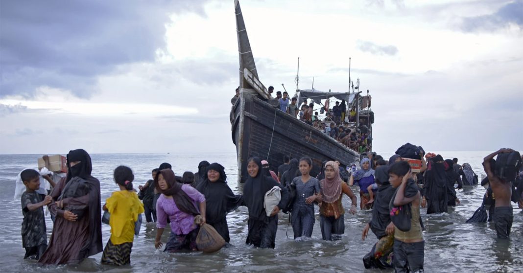 FILE - Ethnic Rohingya disembark from their boat upon landing in Ulee Madon, North Aceh, Indonesia, Thursday, Nov. 16, 2023. Indonesian authorities detected at least five boats packed tight with refugees approaching shores of Aceh province, the latest in a surge of vessels that have arrived in Aceh, most carrying Rohingya refugees from southern Bangladesh, where the persecuted Muslim minority fled in 2017 following attacks by the military in their homeland of Myanmar. (AP Photo/Rahmat Mirza, File)