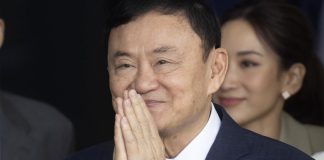 ﻿ FILE - Thailand's former Prime Minister Thaksin Shinawatra greets his supporters as he arrives at Don Muang airport in Bangkok, Thailand, Tuesday, Aug. 22, 2023. Thailand's former Prime Minister Thaksin Shinawatra is a convict serving a prison sentence for wrongdoing in office, but it's not right to call him an inmate, the country's Correction Department declared Tuesday, Jan. 16, 2024. (AP Photo/Wason Wanichakorn, File)