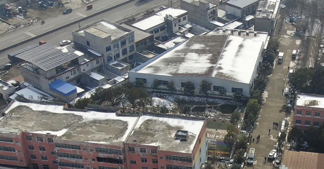 In this photo released by Xinhua News Agency, an aerial drone shows the dormitory with charred windows after a fire at the Yingcai School in Dushu Town, Fangcheng County, Nanyang city in central China's Henan province on Jan. 20, 2024. A fire broke out in dorms at the boarding school for elementary students in central Henan province, and more than a dozen students died in the blaze, Chinese state media reported Saturday. (Wu Gang/Xinhua via AP)