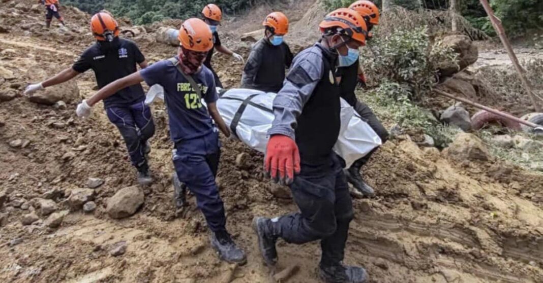 1 of 4 | In this Feb. 9, 2024 handout photo from Municipality of Monkayo, rescuers carry a body they recovered at the landslide-hit village of Maco in Davao de Oro province, southern Philippines. Several villagers remain missing while some bodies have been recovered from underneath the rubble as rescue efforts continue at the landslide-hit area. (Municipality of Monkayo via AP)