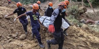 1 of 4 | In this Feb. 9, 2024 handout photo from Municipality of Monkayo, rescuers carry a body they recovered at the landslide-hit village of Maco in Davao de Oro province, southern Philippines. Several villagers remain missing while some bodies have been recovered from underneath the rubble as rescue efforts continue at the landslide-hit area. (Municipality of Monkayo via AP)