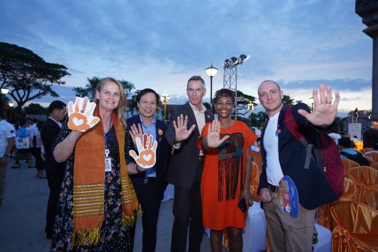 Vientiane’s Patuxay Turns Orange to Say “NO” to Violence Against Women and Girls