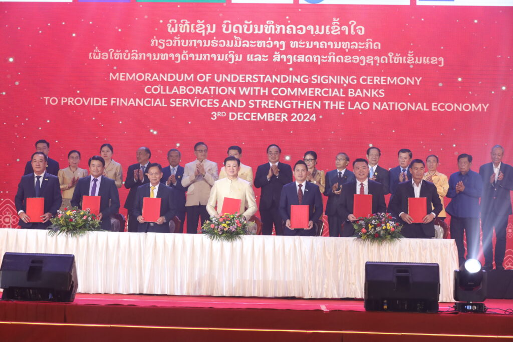 Chanthone Sitthixay, Chief Executive Officer of Lao Bullion Bank Sign A Contract 