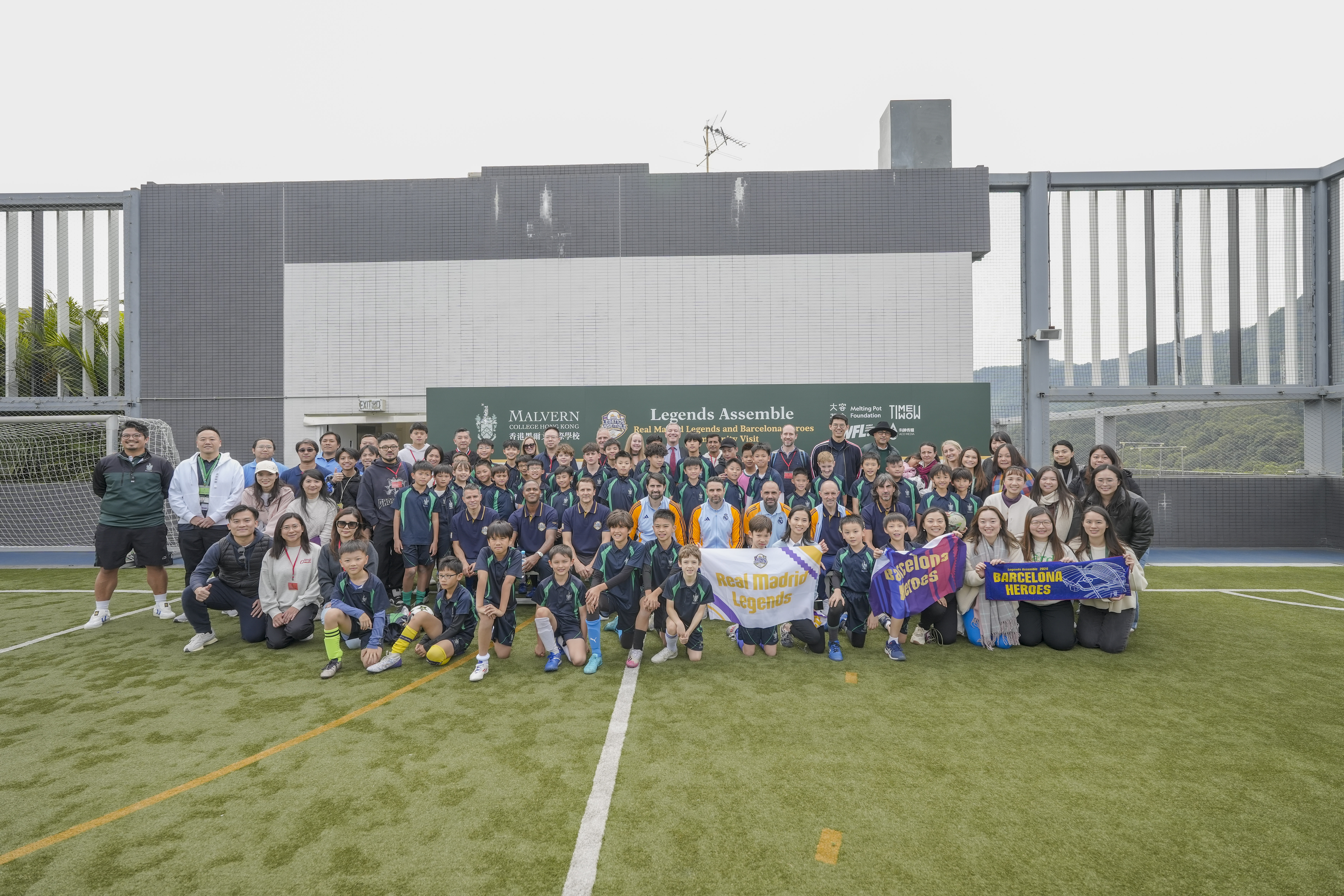 Legends unite L-R: Javier Saviola, Patrick Kluivert, Gaizka Mendieta, Ruben de la Red Gutierrez, Antonia Nunez Tena, Pedro Munitis Alvarez, Jose Emilio Amavisca Garate, and Raul Bravo Sanfelix, alongside members of the Malvern College Hong Kong community, Melting Pot Foundation, Time Wow, WFL, Aco Media, and event organisers.