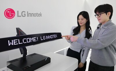 LG Innotek employees demonstrate Nexlide Vision. The product integrates Pixel Lighting, which enables various text and animation effects, and Smart Film technologies.