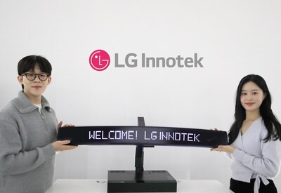 LG Innotek employees demonstrate Nexlide Vision. The product integrates Pixel Lighting, which enables various text and animation effects, and Smart Film technologies.