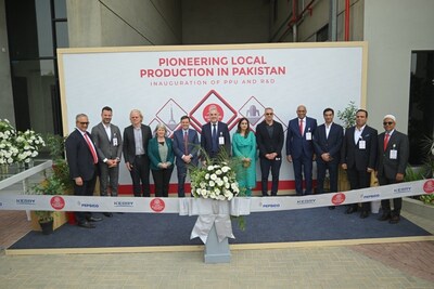 Ribbon cutting ceremony marking manufacturing partnership between Kerry and FEI with Irish Ambassador to Pakistan Mary O'Neill (fourth from left), U.S. Consul General Karachi Scott Urbom (fifth from left), and leaders from Kerry, PepsiCo and FEI.