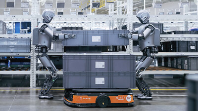 Multiple UBTECH humanoid robots, Walker S1, collaborate to handle large, heavy-duty containers