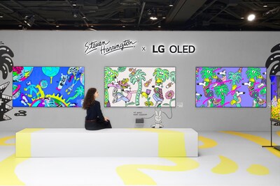 A woman admiring Steven Harrington's vibrant artwork displayed on LG OLED screens inside a creatively designed exhibition space.
