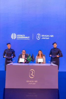 Displaying their commitment to a strategic alliance: James Mulroney, SVP of Client Engagement, Loyalty Juggernaut, and Kim Hardaker, Vice President of Customer Loyalty at Riyadh Air, present their signed agreement. Displaying their commitment to a strategic alliance: James Mulroney, SVP of Client Engagement, Loyalty Juggernaut, and Kim Hardaker, Vice President of Customer Loyalty at Riyadh Air, present their signed agreement.
