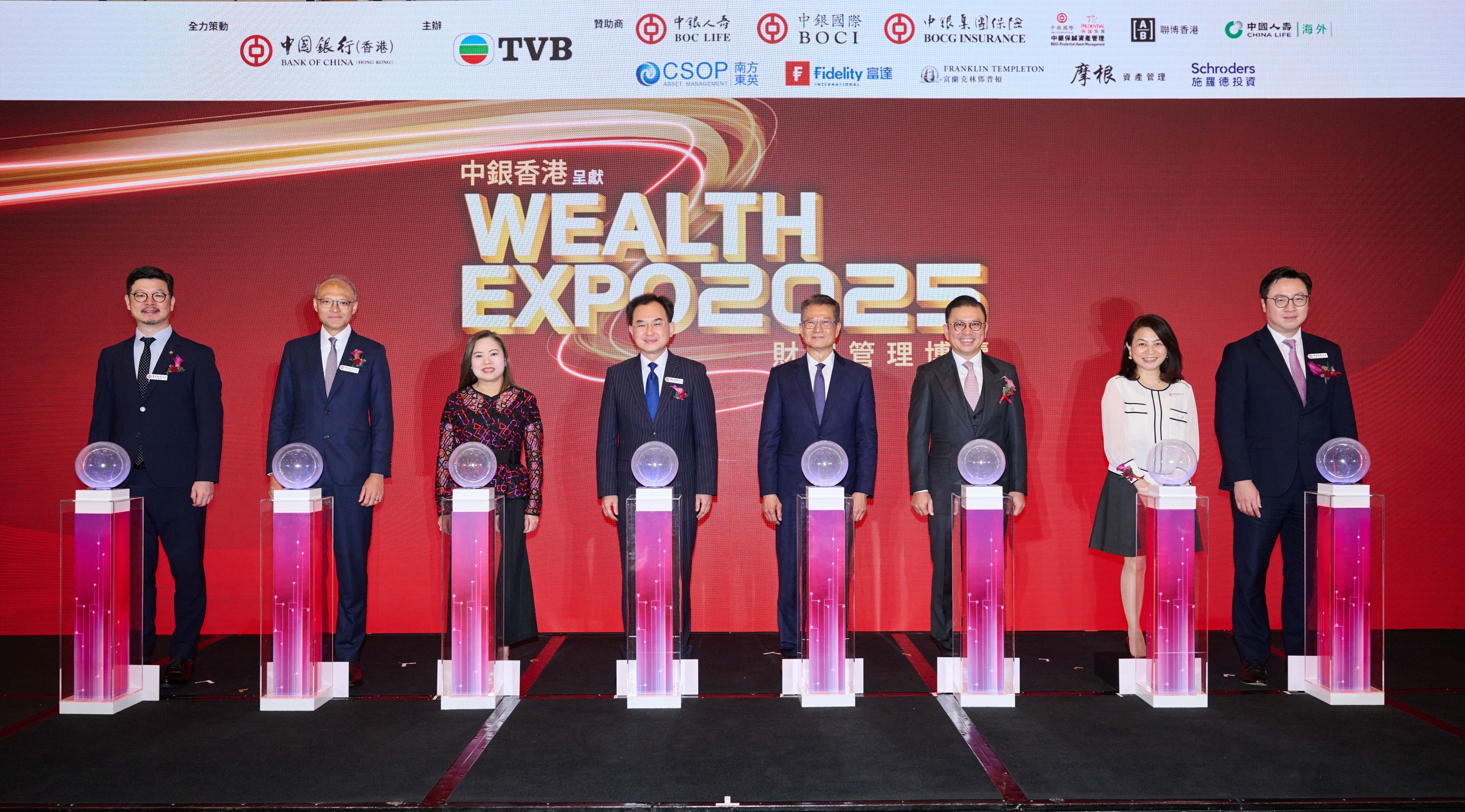 Officiating guests - Mr. Paul Chan, GBM, GBS, MH, JP, the Financial Secretary of the HKSAR Government (Fourth Right), Miss Rosanna Law, JP, Secretary for Culture, Sports and Tourism (Third Left) and Mr. Stephen Chan, Deputy Chief Executive of BOCHK (Forth Left); together with other attending guests including Mr. Thomas Hui, JP, Executive Chairman of TVB (Third Right) and representatives from BOCHK.