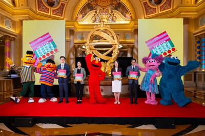 Grant Chum presents a book featuring the art of Sands China’s Art Macao 2025 exhibitions to guests of honour Tuesday.