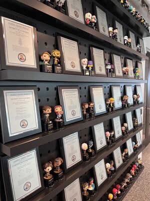 Cognizant’s AI Lab displays 59 patents, with space for the 23 pending patents. The Lab celebrates each inventor with a U.S. Patent plaque and a FunkoPop figurine of their choice. Cognizant’s AI Lab displays 59 patents, with space for the 23 pending patents. The Lab celebrates each inventor with a U.S. Patent plaque and a FunkoPop figurine of their choice.