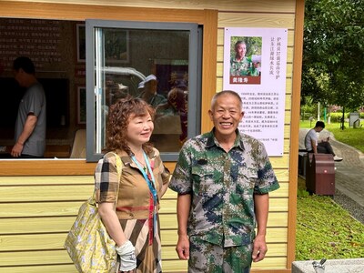 Journalists engage in a heartfelt conversation with local forest ranger Gong Longshou.