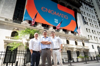 Enigmatig’s Senior Leadership Team celebrates a milestone at the New York Stock Exchange: Desmond Foo, Founder & CEO (center), Mingwen Teo, Director & CFO (right), and Ryan Tay, COO (left) (Photo Credit: Enigmatig)