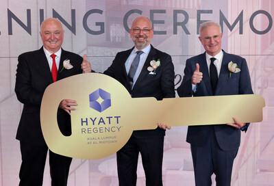 Thomas Karl Rapp (from left) handover the master key to Till Martin and David Udell.