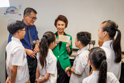 SMS Low Yen Ling with Principal and students of Sengkang Green Primary School