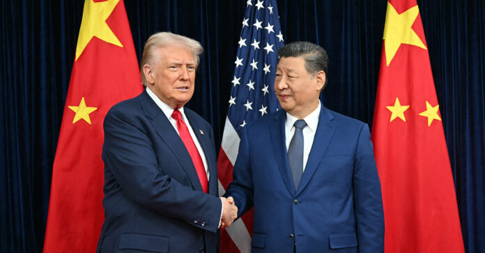 US President Donald Trump (L) and China's President Xi Jinping shake hands as they arrive for talks at the Gimhae Air Base, located next to the Gimhae International Airport in Busan on October 30, 2025. Donald Trump and Chinese leader Xi Jinping will seek a truce in their bruising trade war on October 30, with the US president predicting a "great meeting" but Beijing being more circumspect.