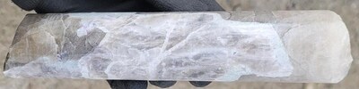 Figure 2: Pollucite with late stage spodumene/pollucite (white) veining displaying classic “tapioca” texture (white blebs) at a depth of ~43.7 m in drill hole CV25-979 from the Helios Zone. Core grades 0.5 m at 2.33% Cs2O within a wider mineralized interval of 4.9 m at 3.65% Cs2O (39.0 m to 43.9 m)