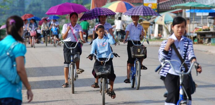 student riding bicycles