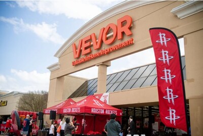 The exterior of VEVOR's Houston flagship store during its grand opening event, featuring a collaborative fan zone with the Houston Rockets.