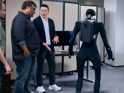 LG Corp. Chairman and CEO Kwang Mo Koo (right) observes a humanoid robot demonstration with Abhinav Gupta (left), co-founder of Skild AI, on April 2