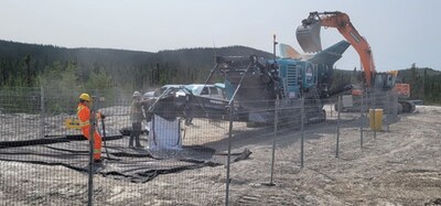 Figure 4: Crushing of spodumene pegmatite boulders into bulk bags.