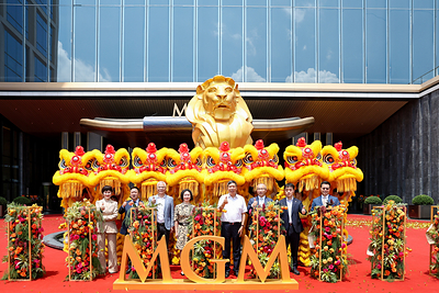 Representatives pose for a group photo during the grand opening of MGM Shenzhen Prince Bay with traditional lion dance performers. Representatives pose for a group photo during the grand opening of MGM Shenzhen Prince Bay with traditional lion dance performers.
