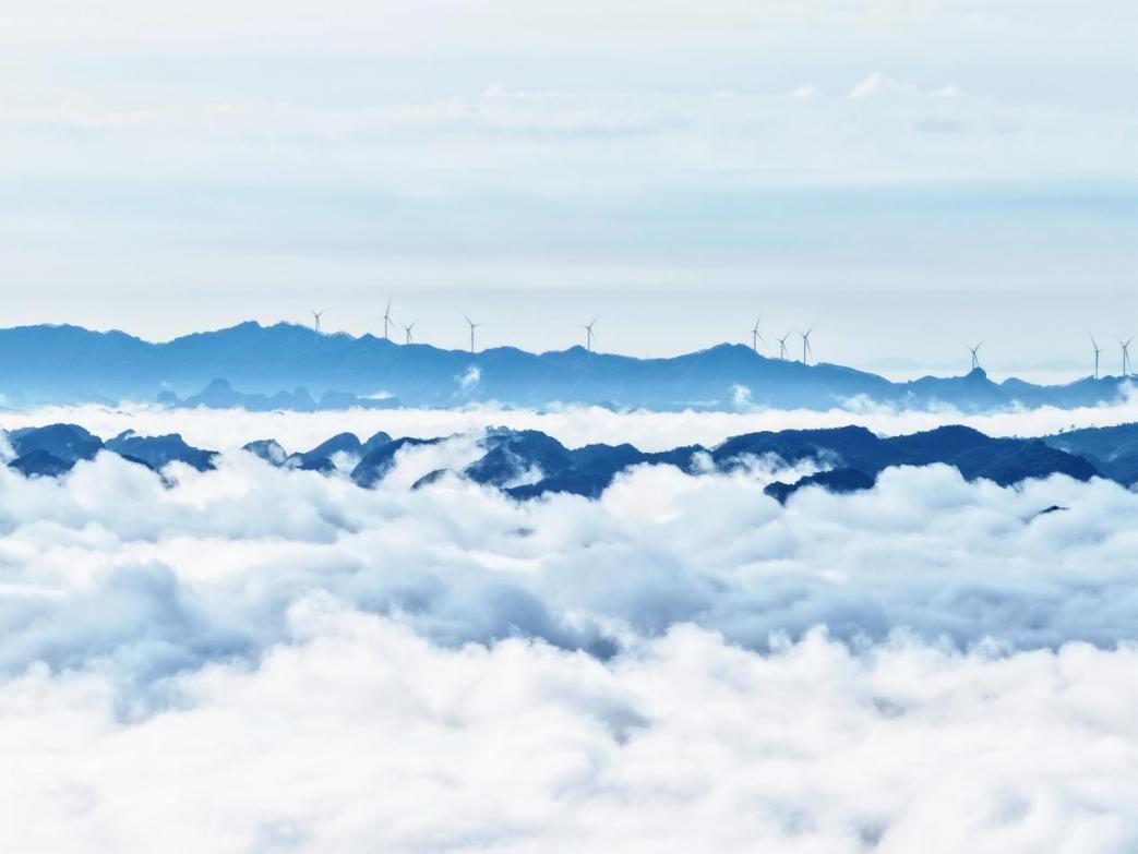 Bahe Wind Farm in Tiandeng County, Guangxi, where wind turbines stand amid the region's distinctive karst landscape.